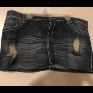 Distressed mini jean skirt